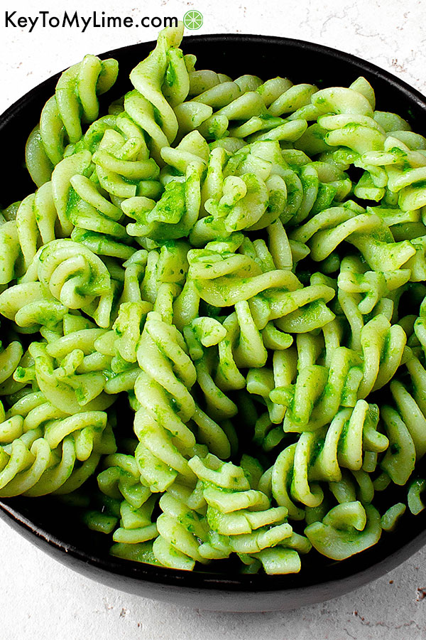 Oil free vegan spinach pesto on pasta in a bowl.