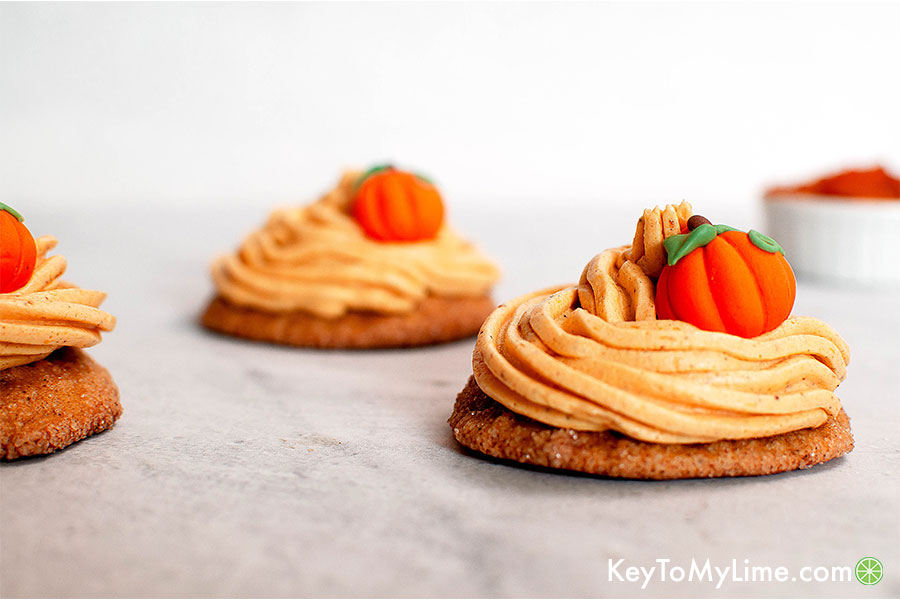 Pumpkin cake cookies with pumpkin buttercream frosting.
