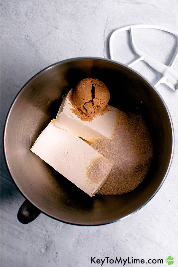 Cream cheese, sugar, and brown sugar in a stand mixer bowl.