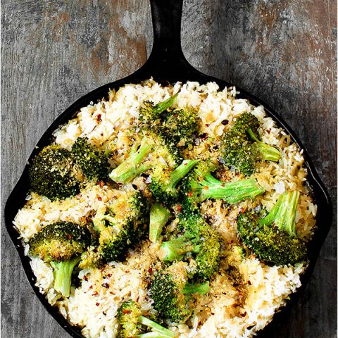 Vegan broccoli cheese and rice casserole in a skillet.