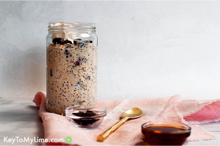 Healthy maple overnight oats with cranberry in a jar.