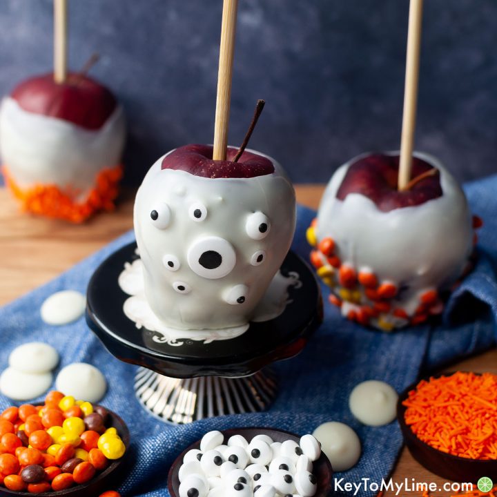 Halloween apples dipped in white chocolate and rolled in candy.