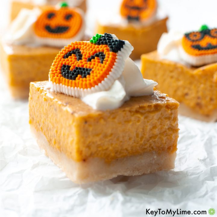 A side image of pumpkin pie bars on a white background.