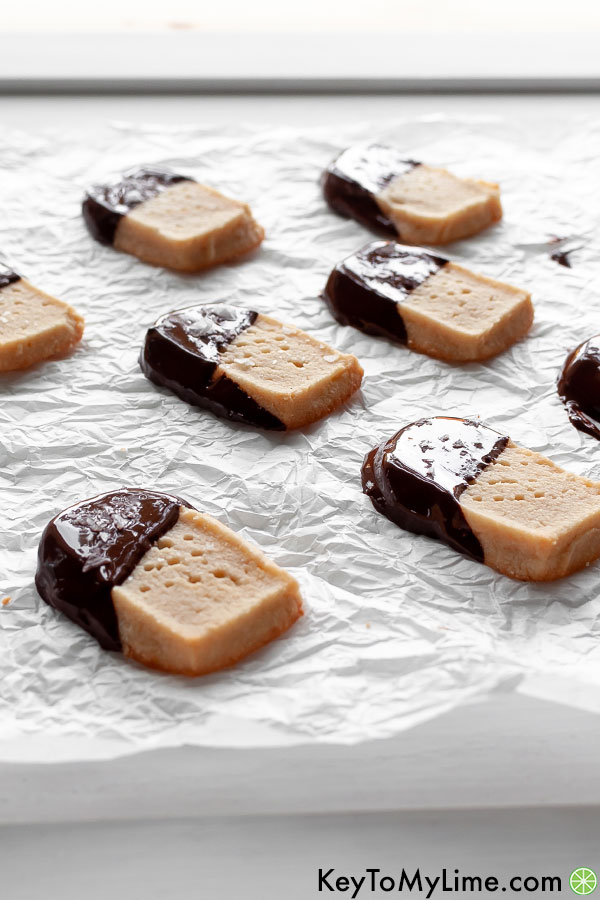 Chocolate dipped keto shortbread with light glistening off the chocolate.