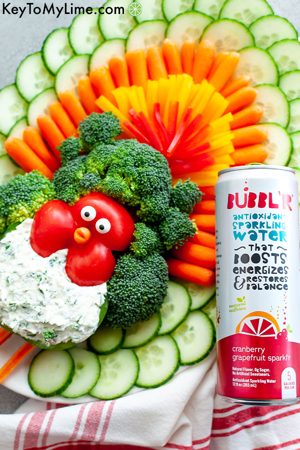 A turkey vegetable platter with a can of antioxidant sparkling water.