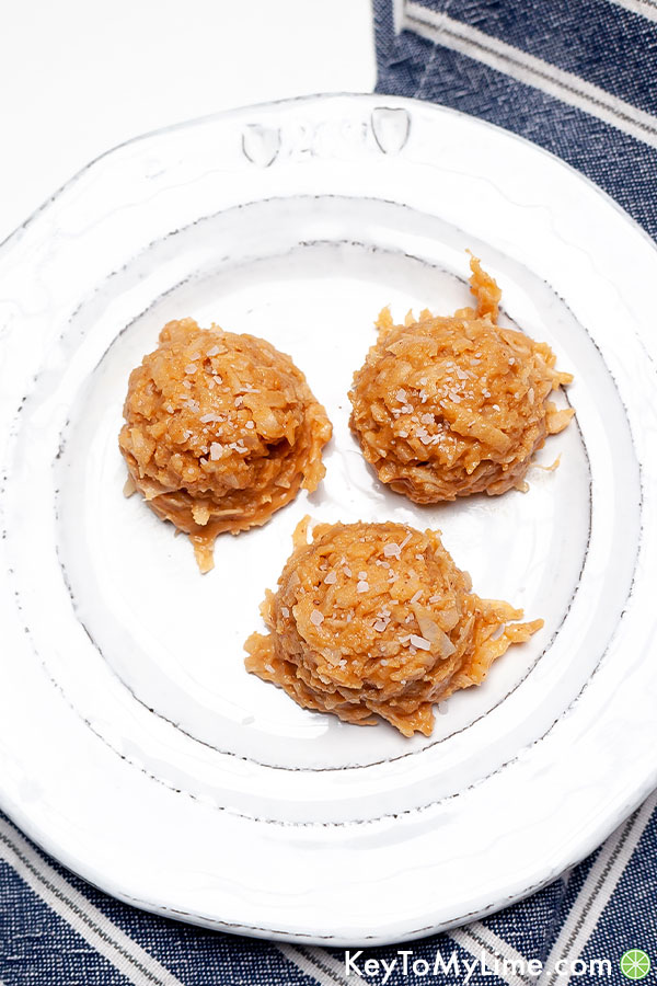 Low carb peanut butter haystack cookies on a white plate with a blue napkin.