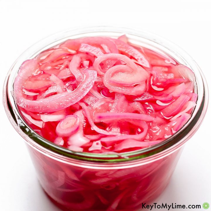 Quick pickled red onions in a jar.