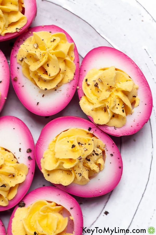 A close up image of beet pickled hard boiled eggs.