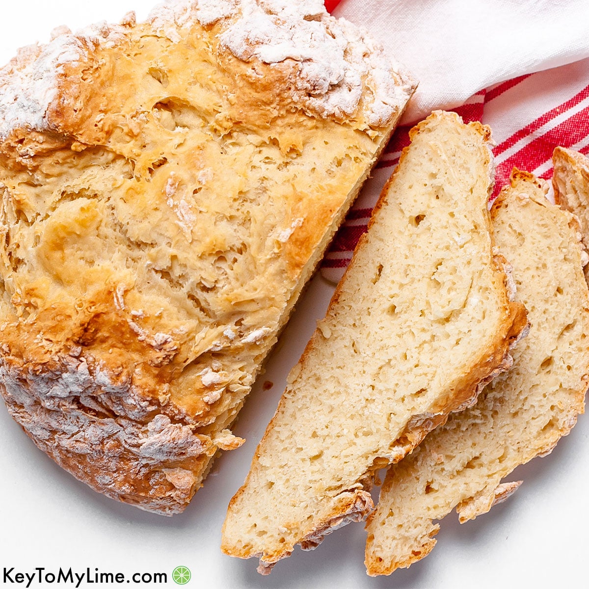 An Irish soda bread loaf with sliced pieces of bread.