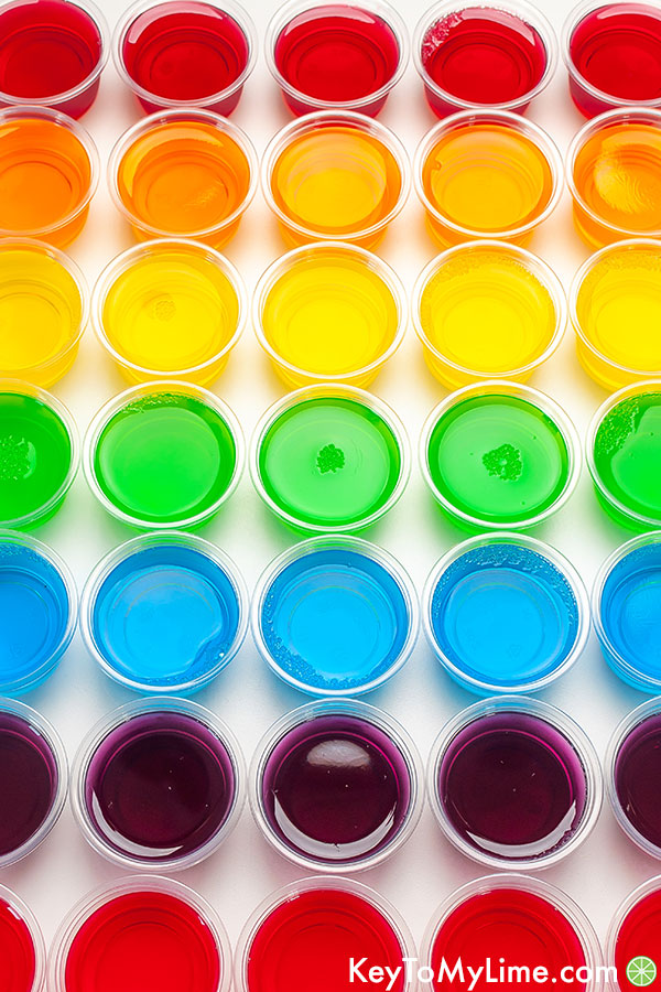 An image of jello shots arranged in rainbow order.