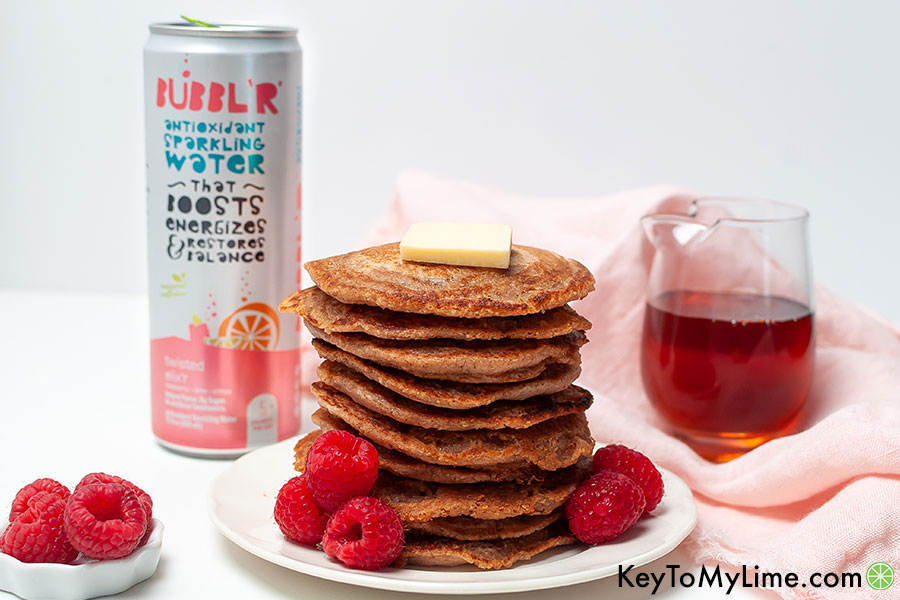 A pancake stack next to a can of sparkling water.