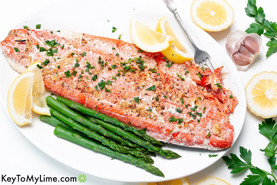 A horizontal image of a baked salmon filet.