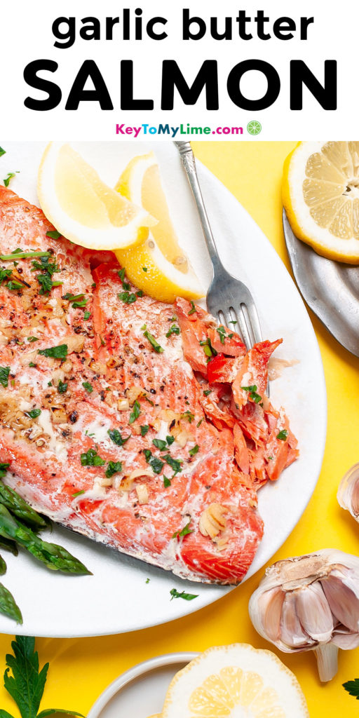 A Pinterest pin image with a picture of garlic butter salmon and title text.