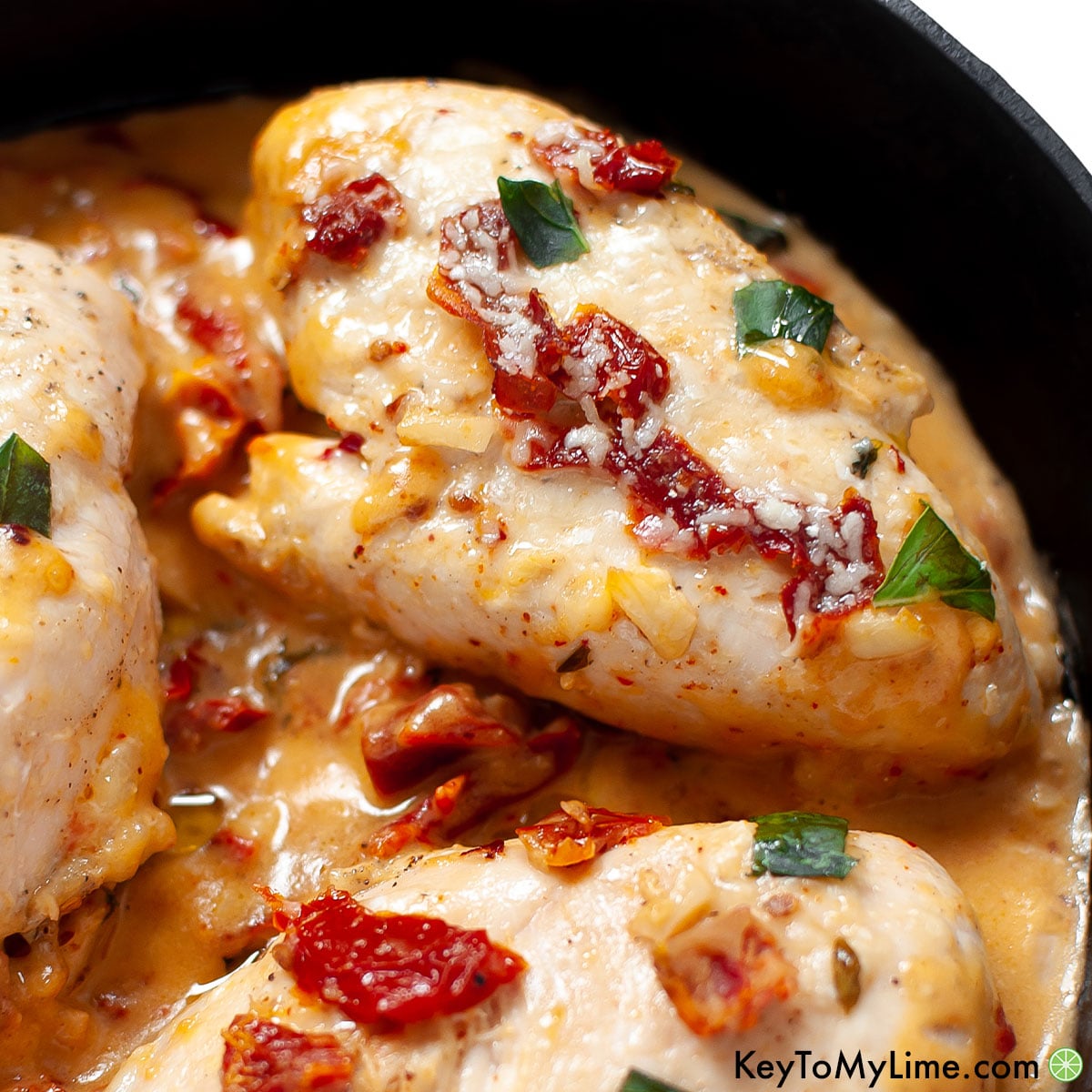 A close up of a creamy Marry Me Chicken breast.