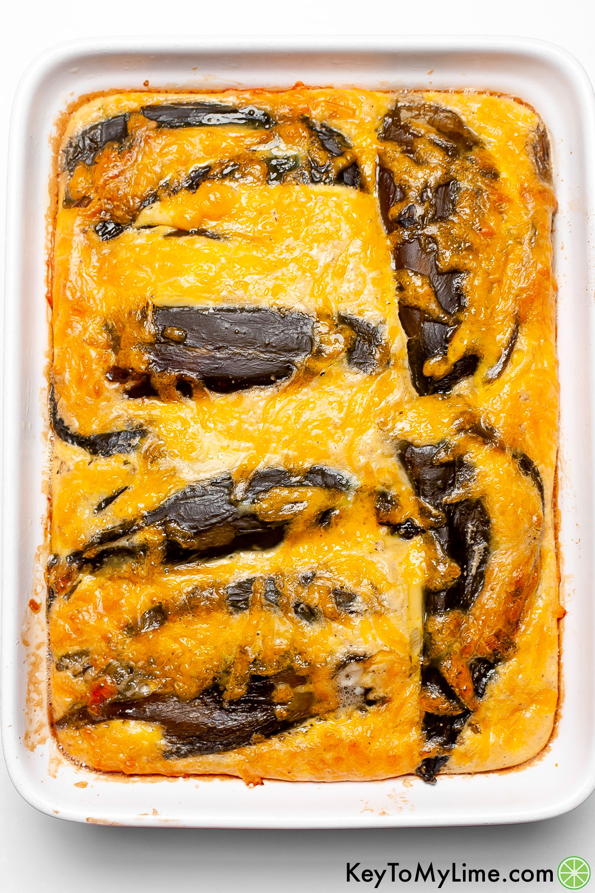 A picture of chile relleno casserole showing how the casserole is puffy and fluffy right when it comes out of the oven.