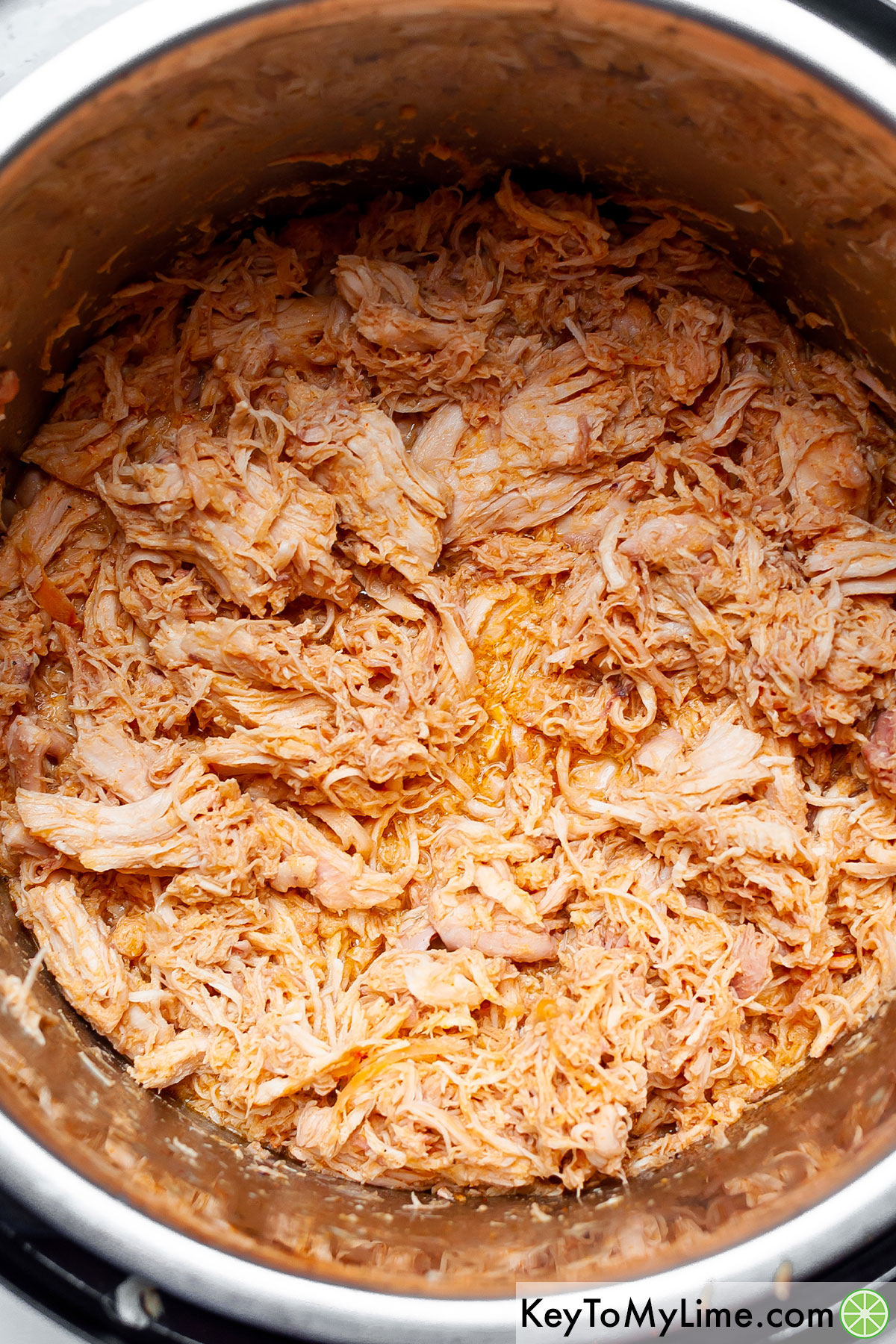 A picture of pulled chicken in an Instant Pot.