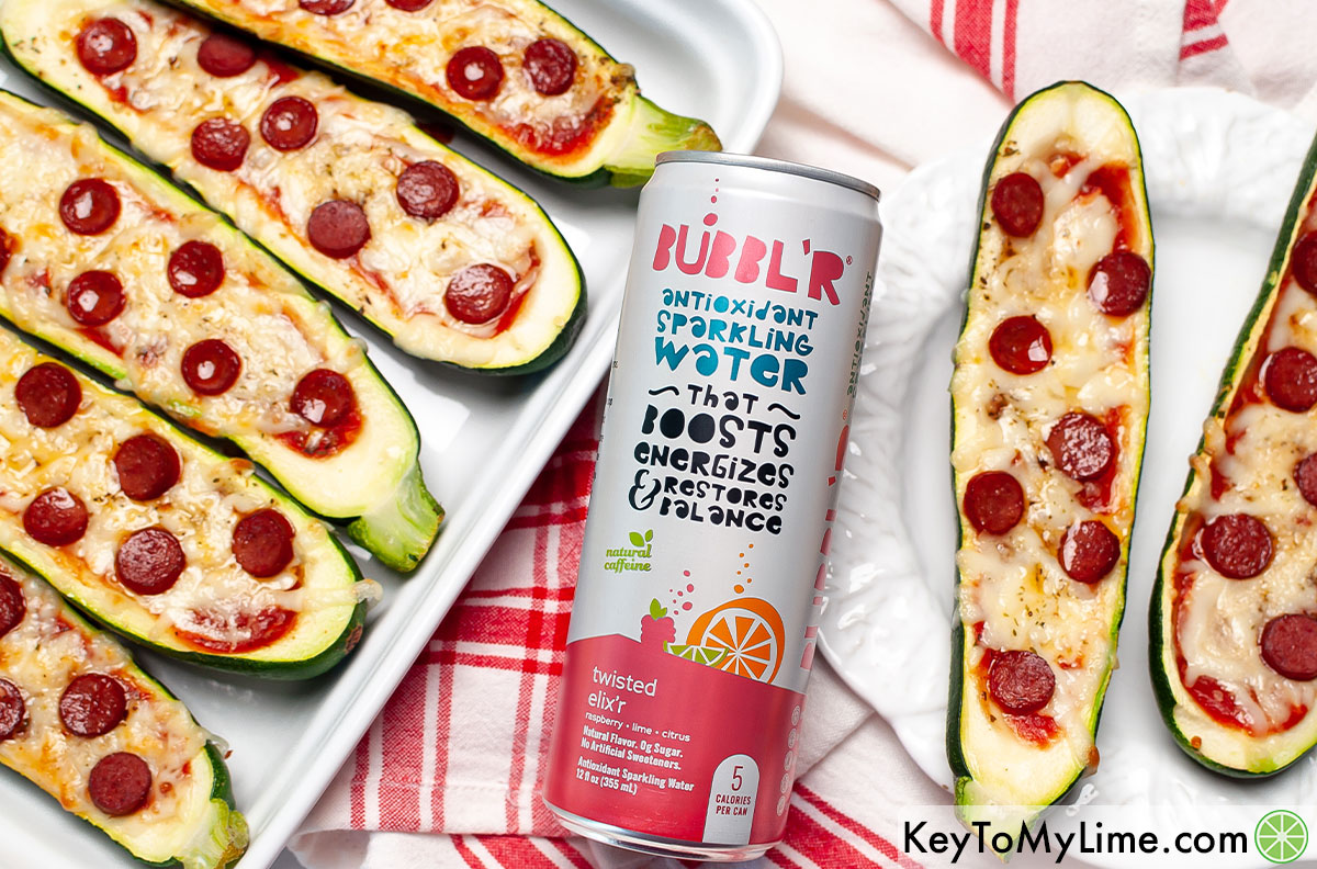 Zucchini pizza boats next to a can of BUBBL'R.