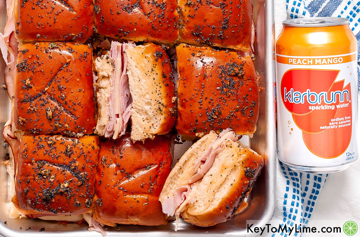 Ham and cheese sliders next to a can of Klarbrunn.