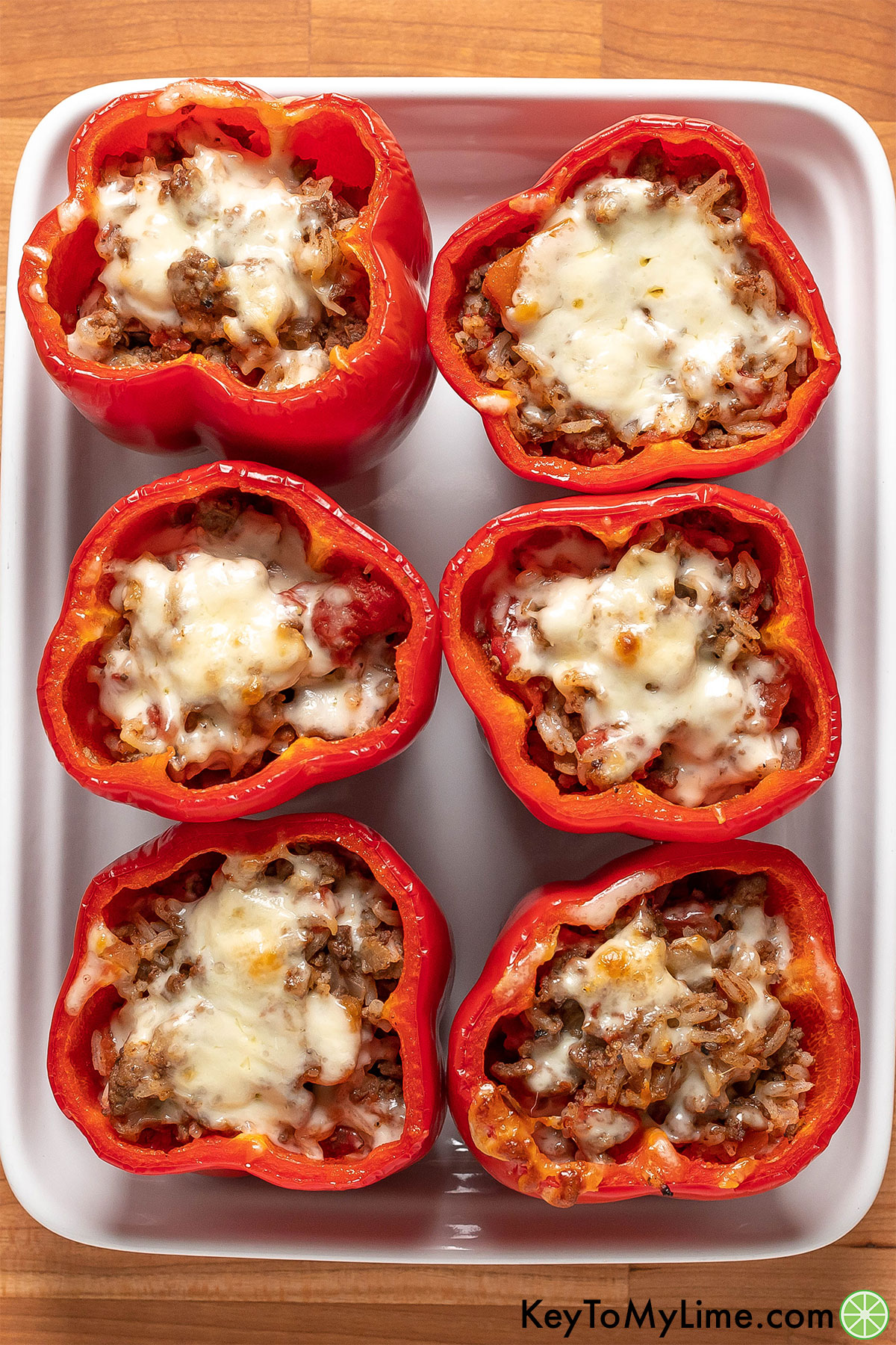 Stuffed bell peppers on a tray fresh out of the oven.
