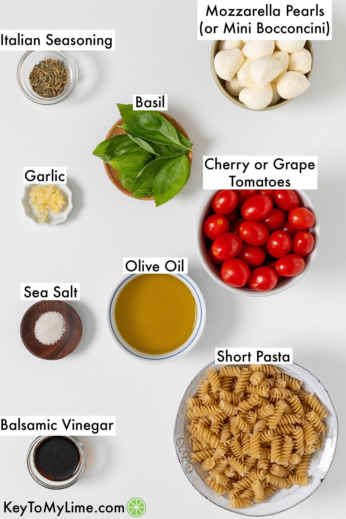 The labeled ingredients for caprese pasta salad.