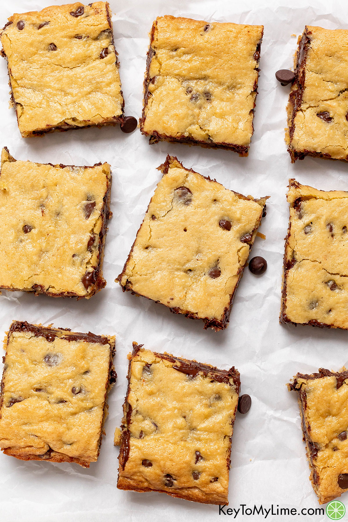 An overhead shot of cookie bars on parchment paper.