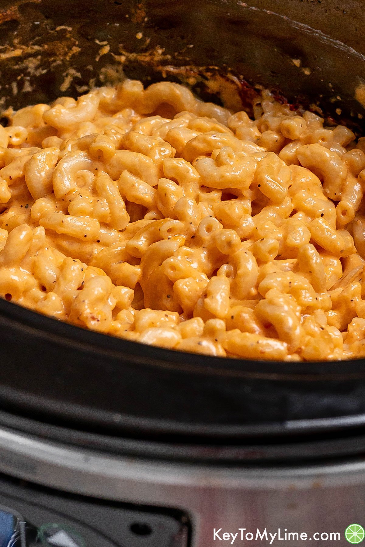 Thick and gooey cheddar mac and cheese with pepper flakes mixed throughout.