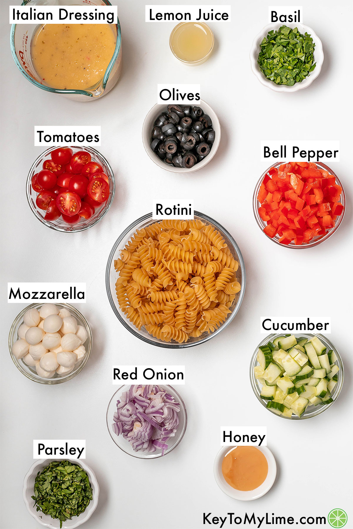 The labeled ingredients for pasta salad with italian dressing.