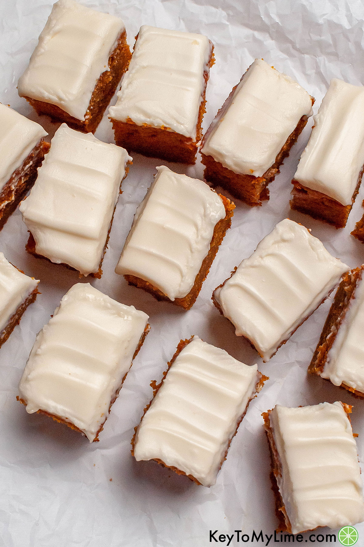 An overhead image of pumpkin bars with frosting on the top.