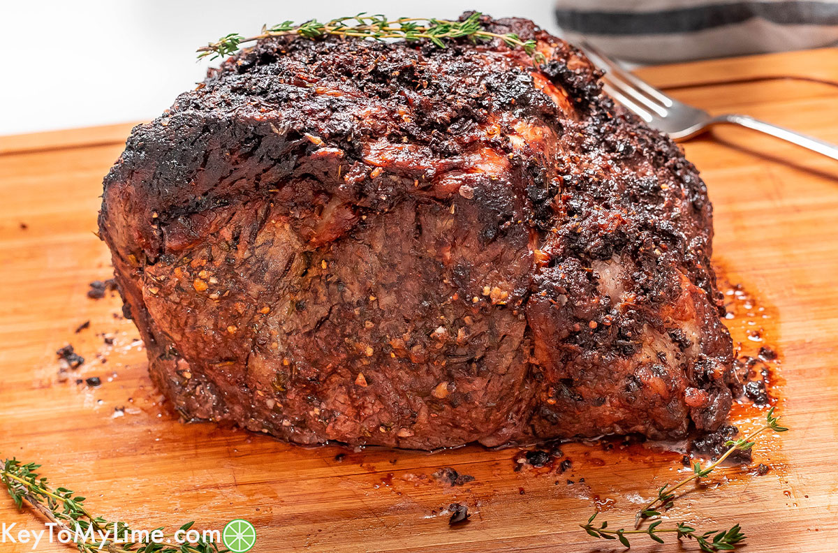 A side shot of the prime garnished with fresh thyme sprigs.