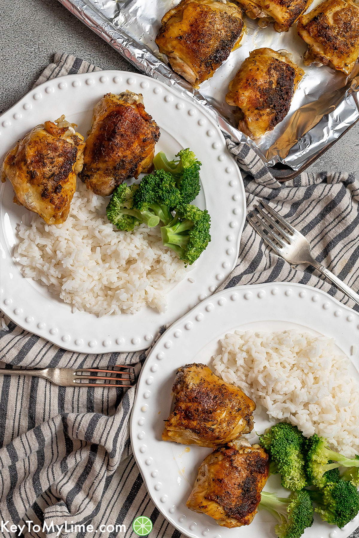 An image with multiple plates filled with delicious broccoli, rice and crispy chicken thighs.