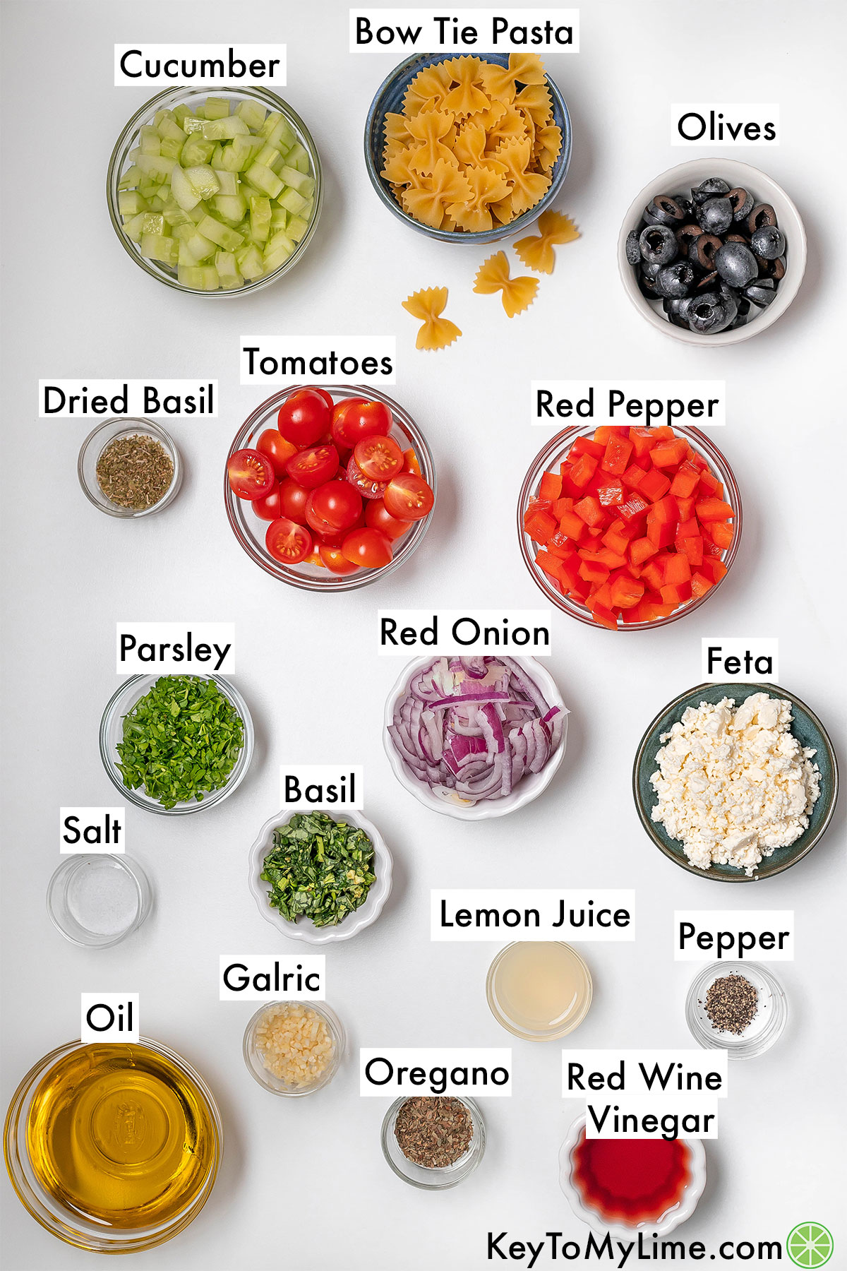 The labeled ingredients for bow tie pasta salad.