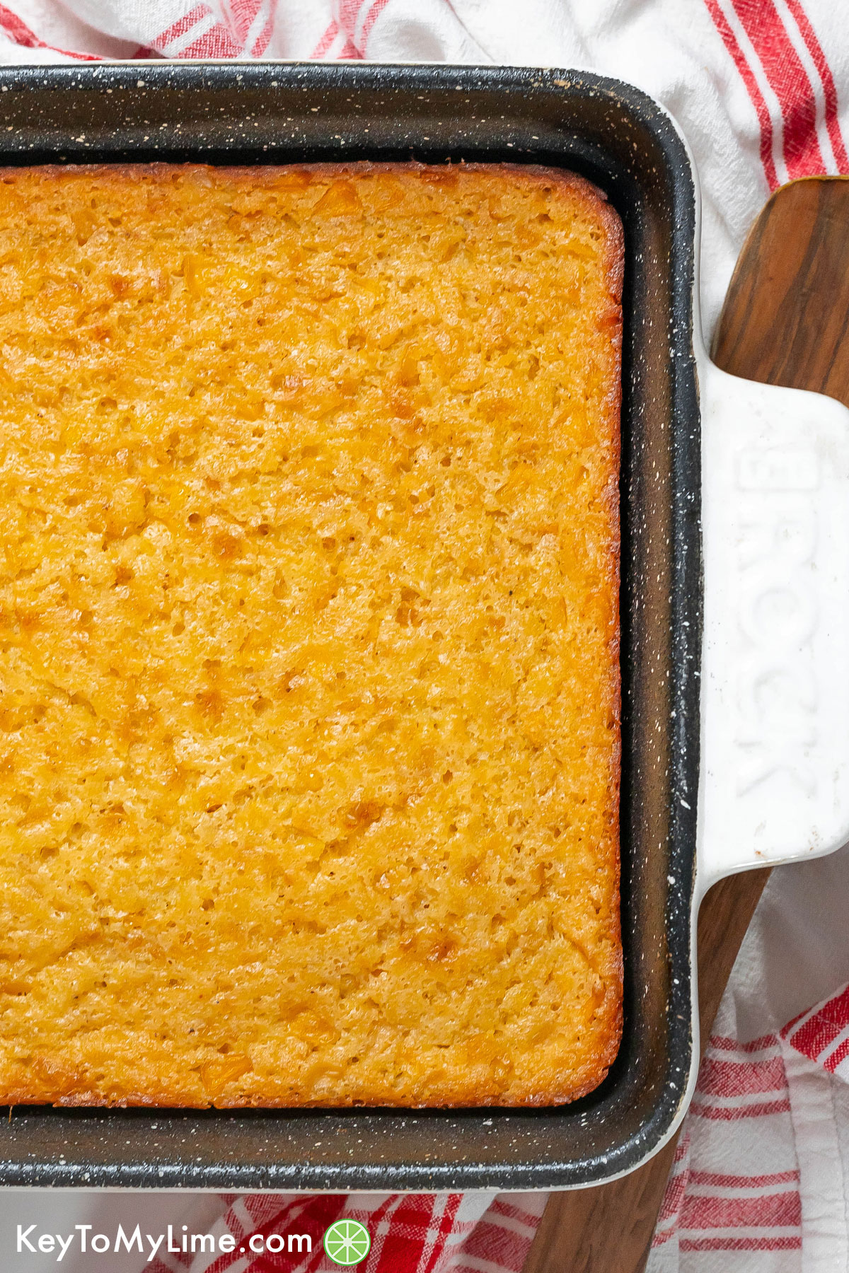 An overhead image of a finished corn casserole dish with golden edges throughout.