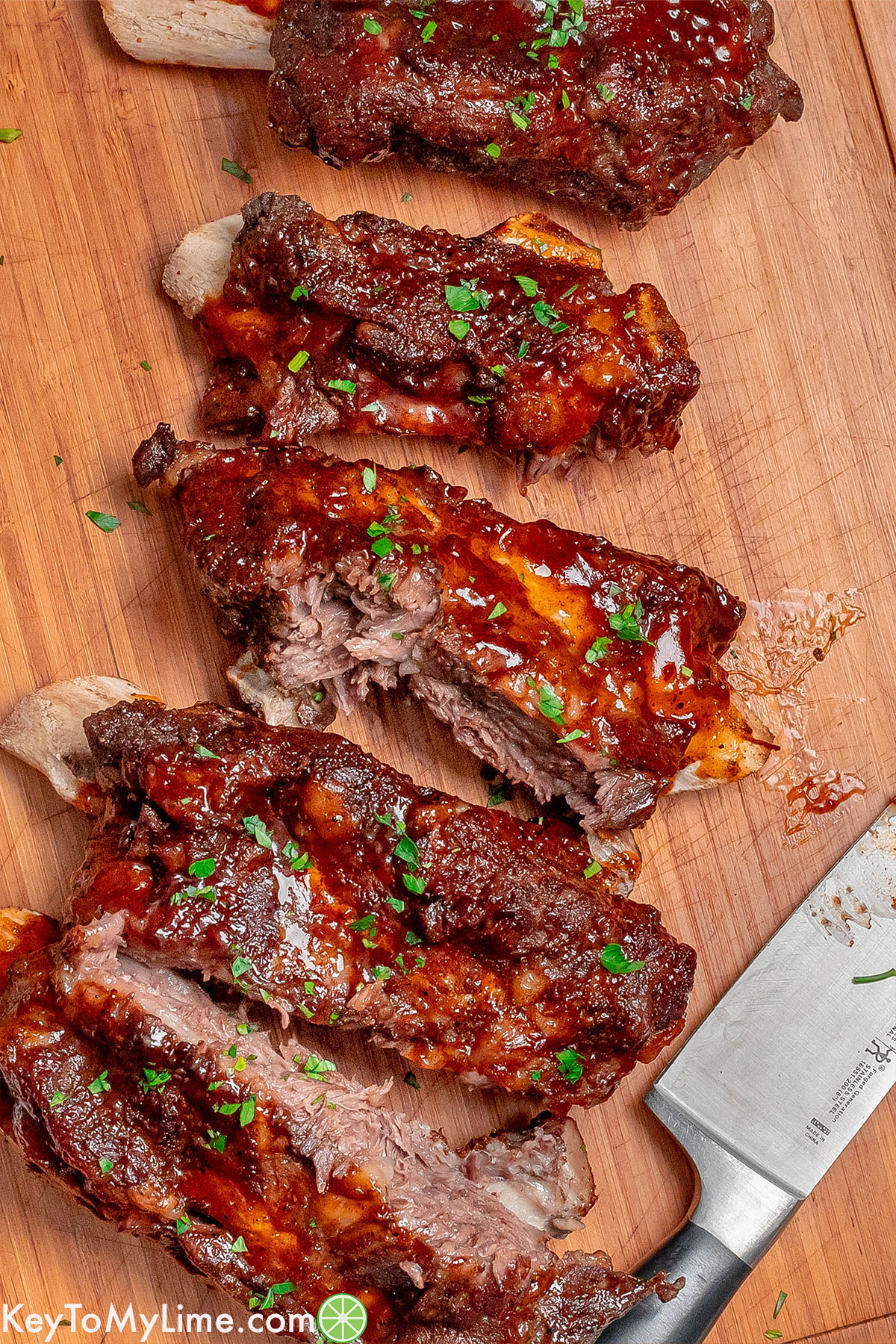 An overhead image of ribs on a cutting board.