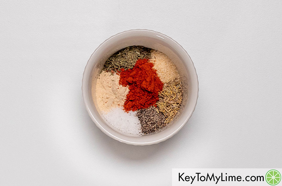 A small mixing bowl of dry spices ready to be mixed.
