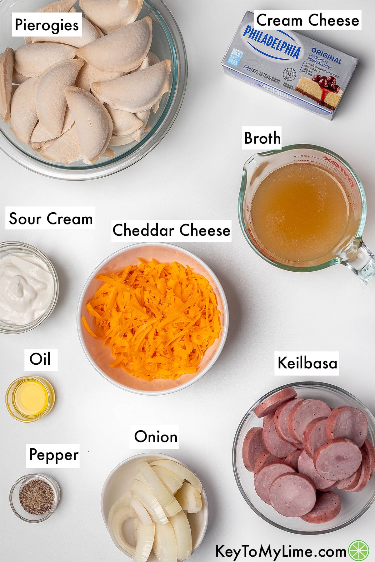 The labeled ingredients for crockpot pierogi casserole with kielbasa.