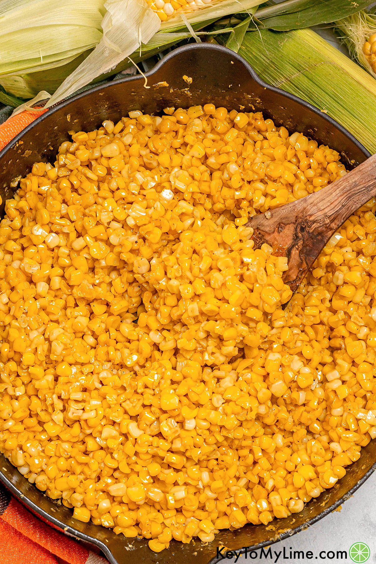 An overhead image of a skillet full of fried corn.