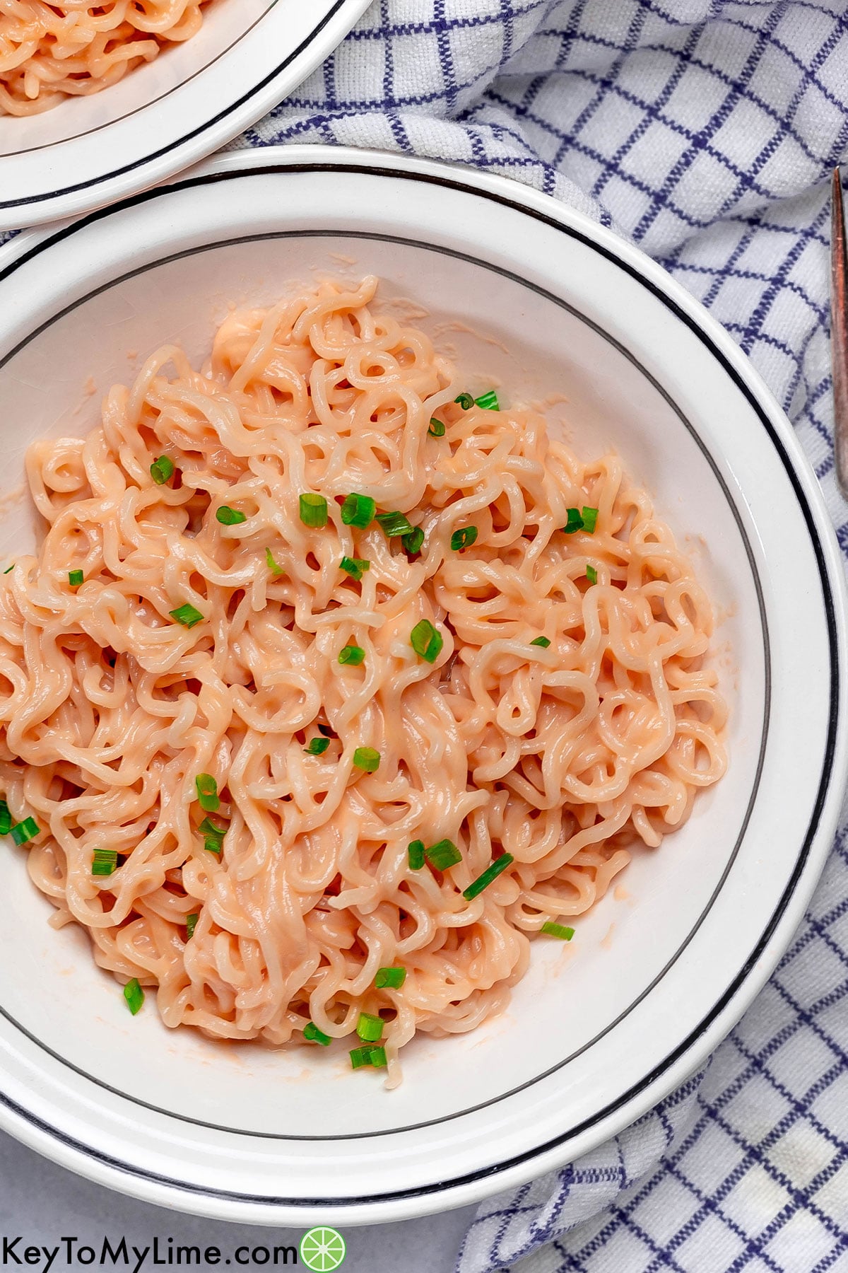 An overhead image of a plated bowl filled with ramen.