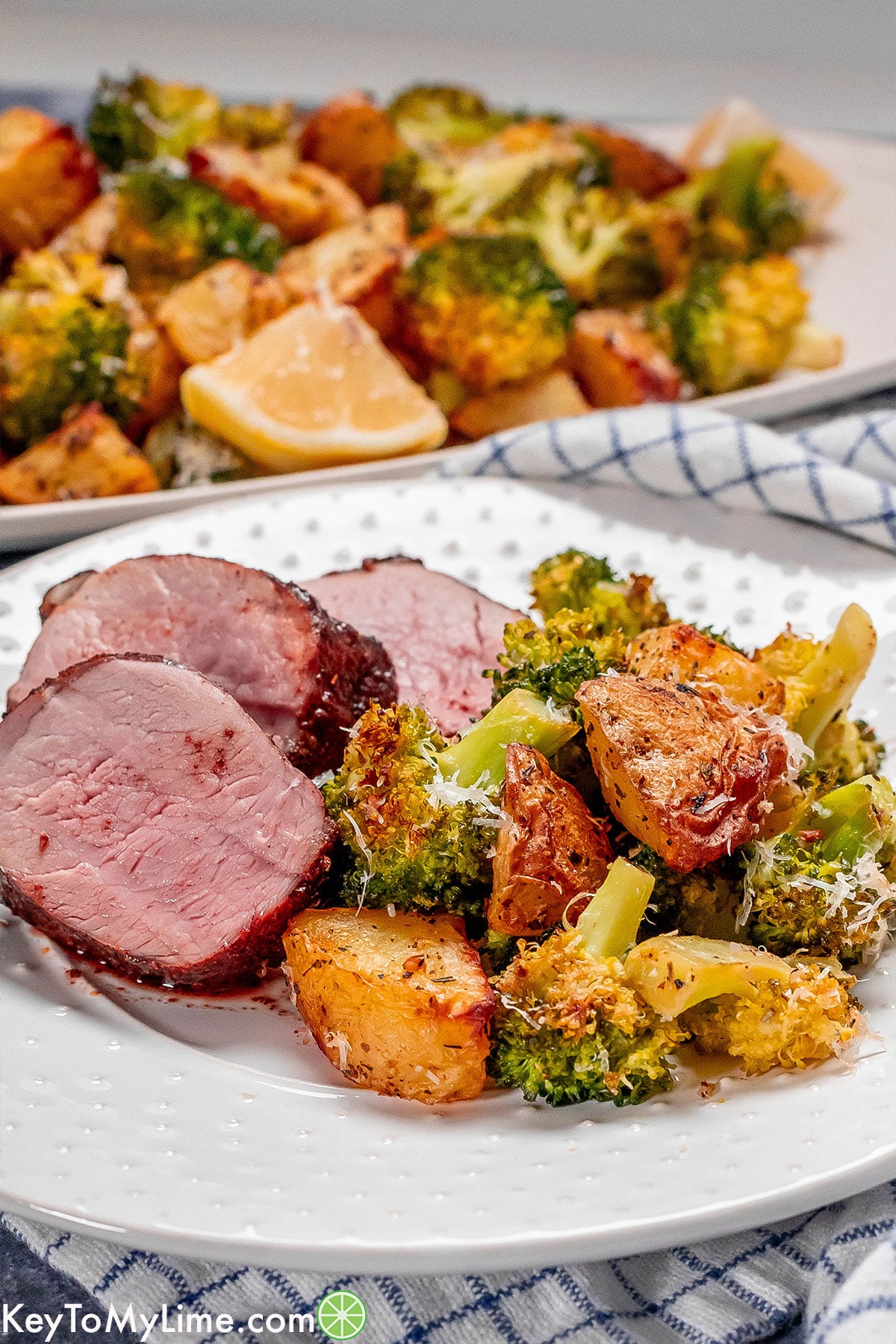 A side image of the finished roasted potato dish garnished with parmesan.