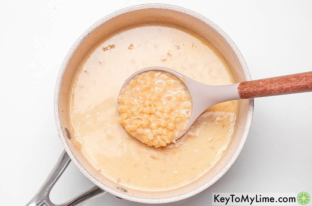 Stirring the soup until the cheese has melted, and then ladle into small bowls.