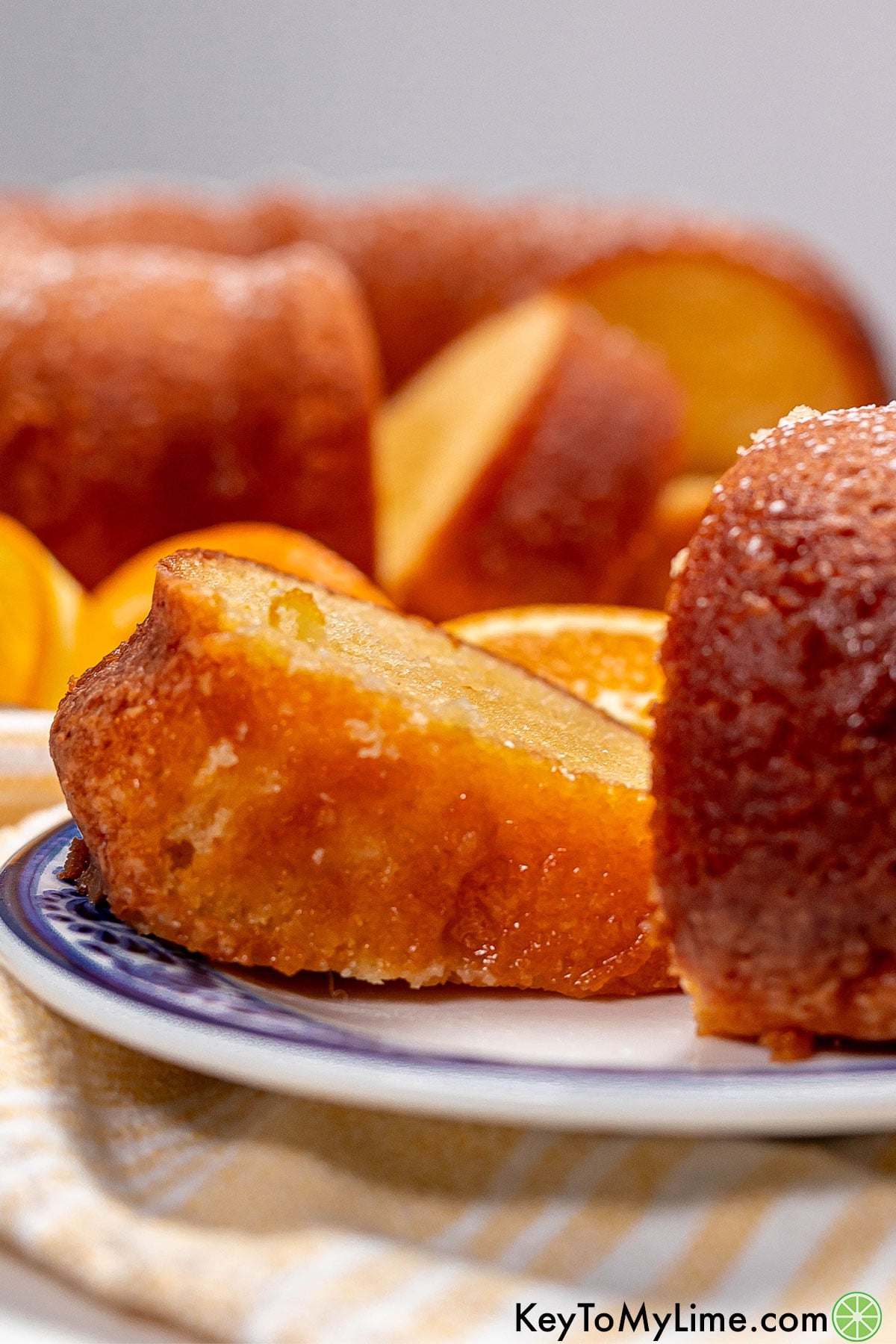 A sliced orange juice cake served on a plate.