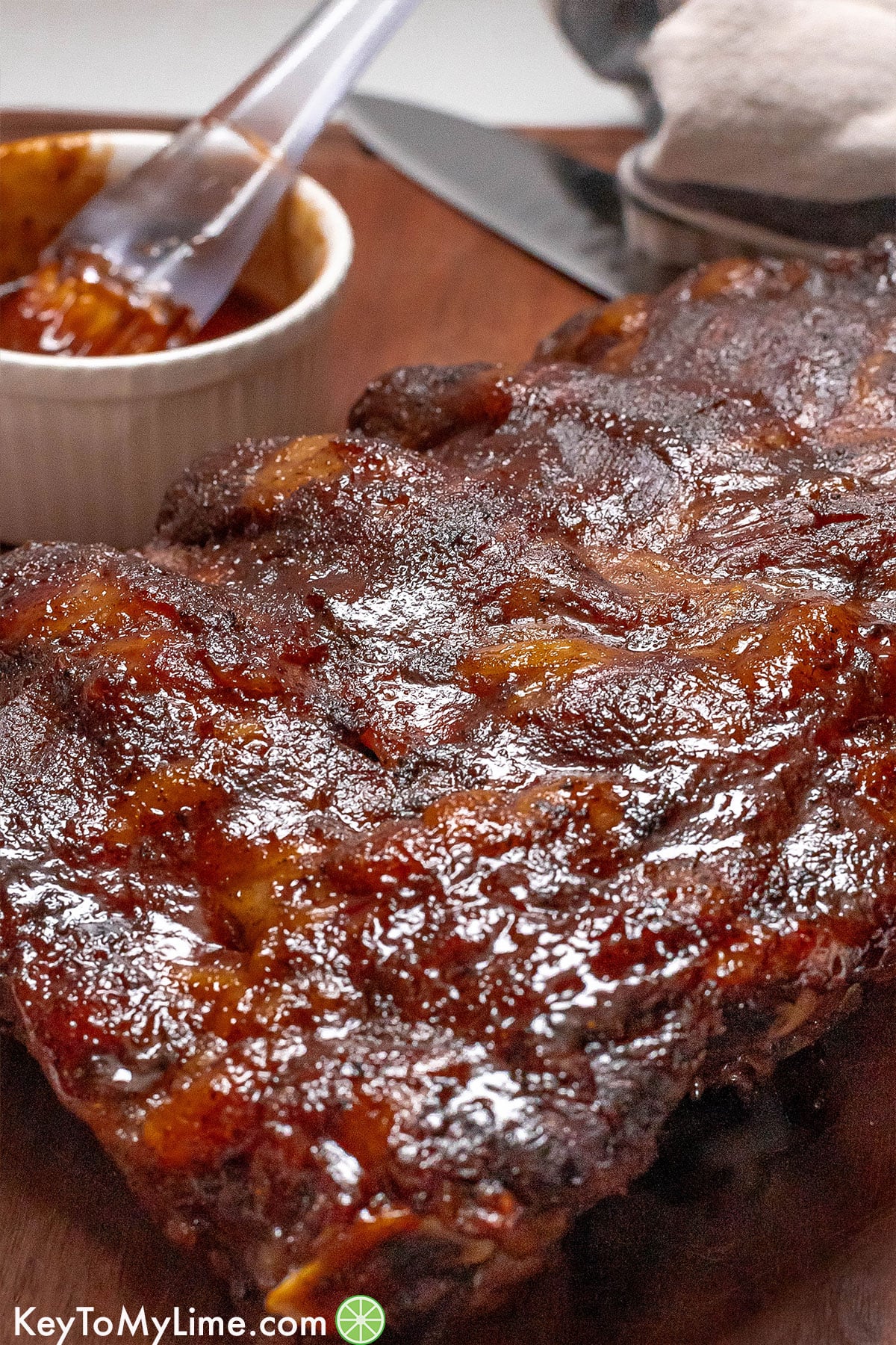 A close up showing the caramelized glaze on top of the beef ribs.
