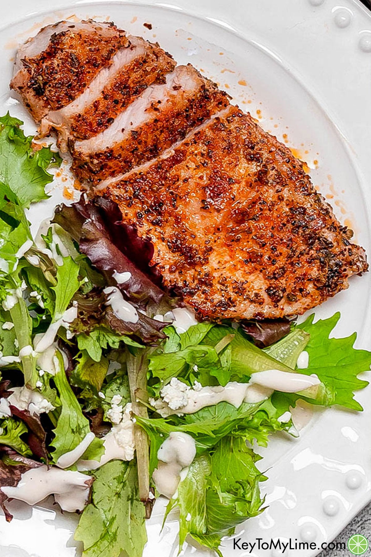 An overhead image of a sliced thin pork chop with a beautiful crust.