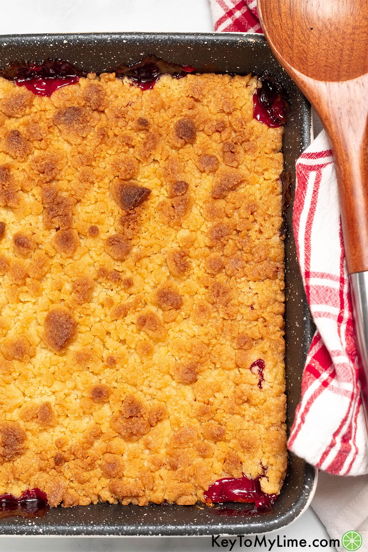 A freshly baked cobbler with a golden brown crust in a large baking dish.