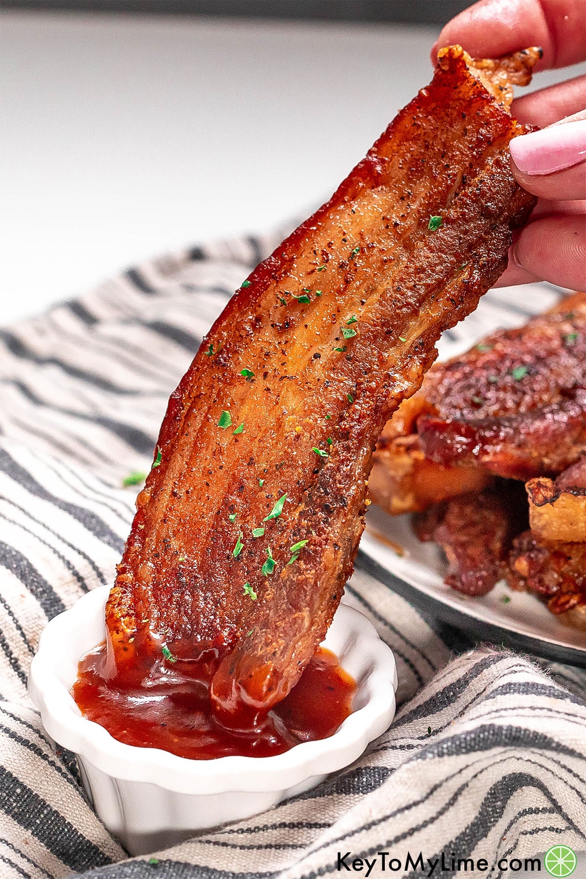 A side image showing how crispy the pork belly strip is after baking.