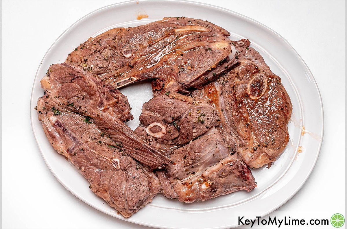 Removing the chops from the skillet and resting for 5 minutes.